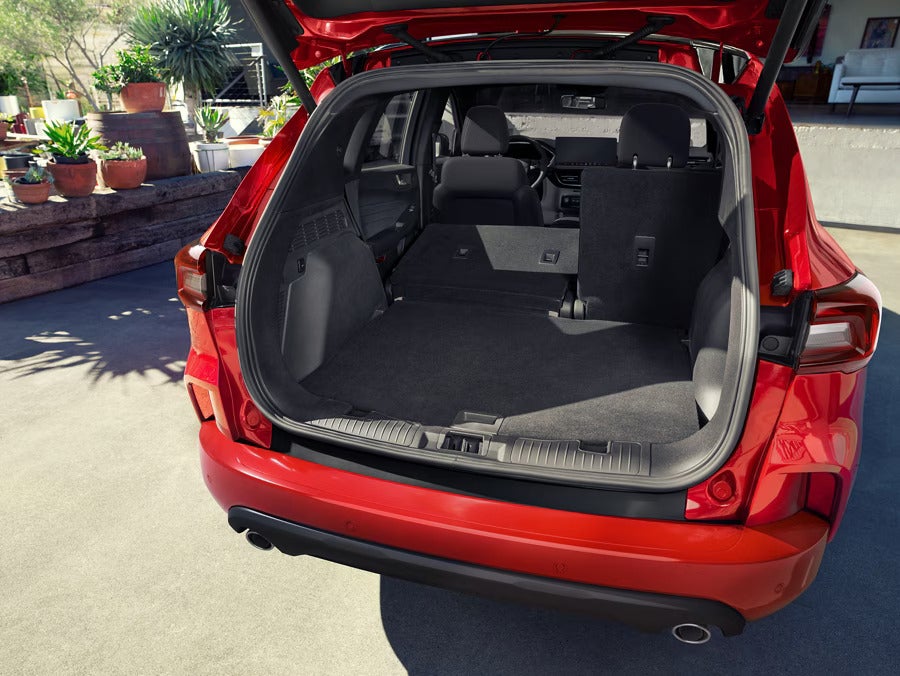 the cargo space of a red suv