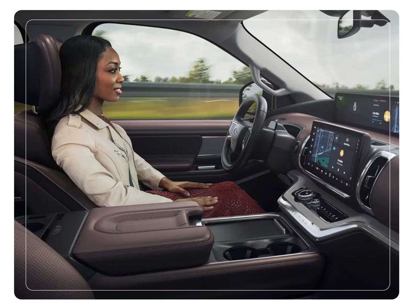 a women sitting in the drivers seat of a ford expedition suv