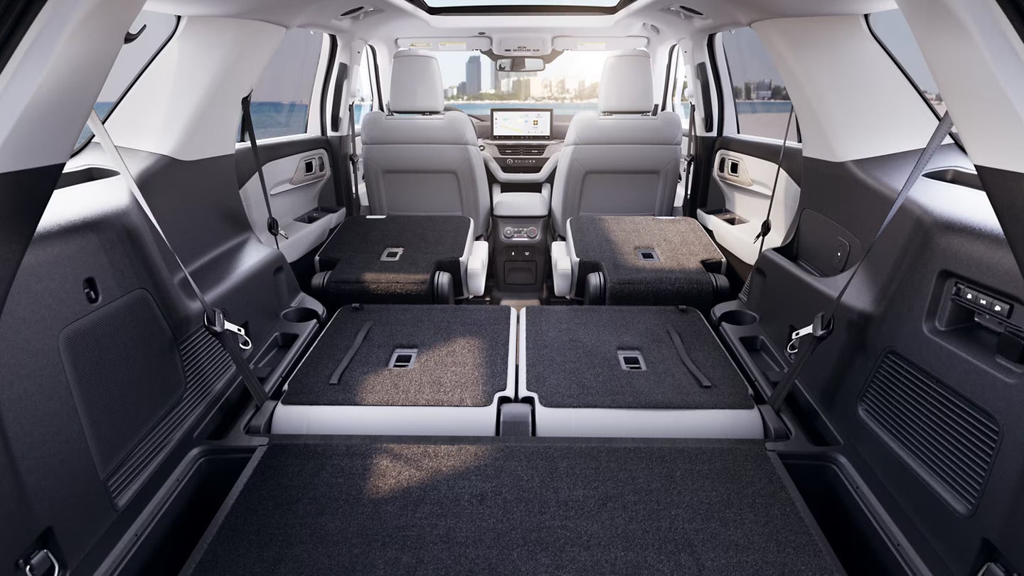 Cargo area of the 2025 Ford Explorer with rear seats folded down for expanded space.