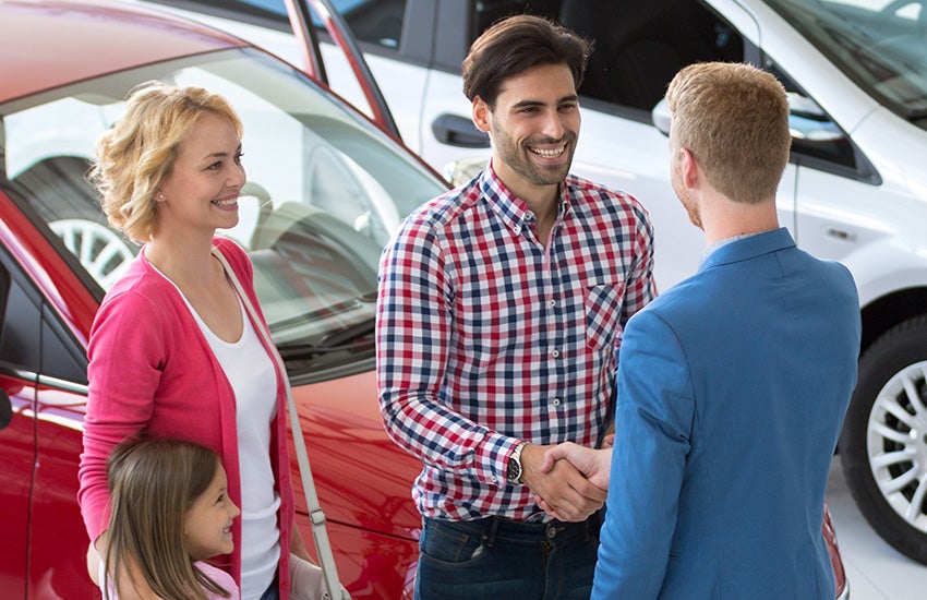 a family purchasing a vehicle